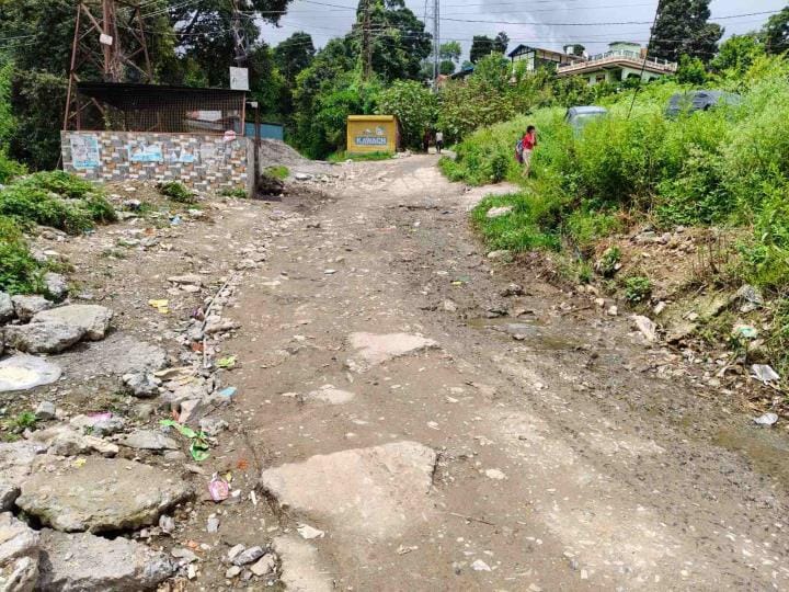 The road was broken a year ago to lay the pipeline, now there is no budget to build it