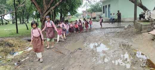 Students forced to go to school through muddy roads