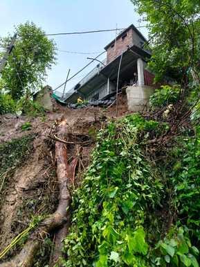 The shed collapsed due to rain, the house is in danger