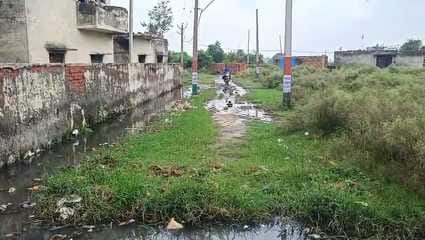 Waterlogging on the road due to lack of cleaning of drain
