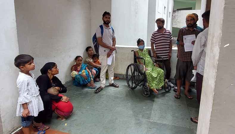 A double whammy for the disabled... there were no benches, the doctors also made them wait for hours
