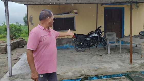 The leopard took away the dog sitting near the villager