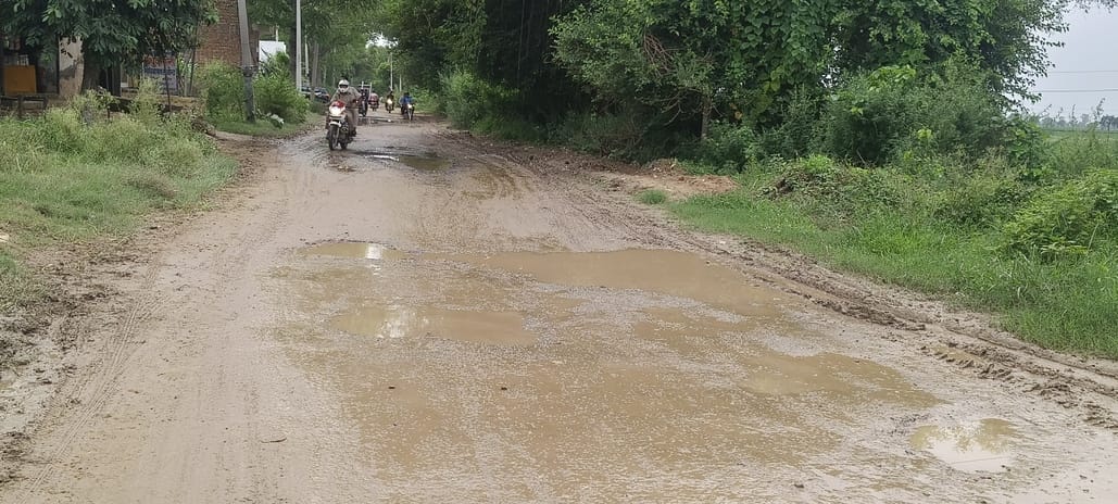 Deep potholes on the road cause trouble and risk of accident
