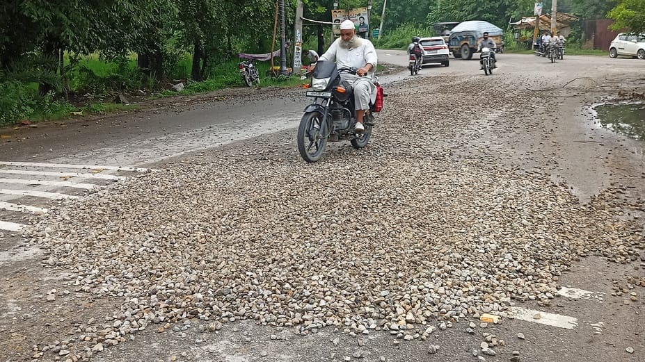Gravel scattered on the road from the dumper, bike rider fell