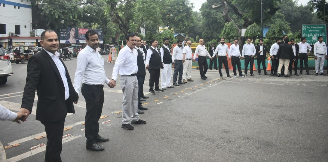 Advocates formed a human chain and demonstrated at the Commissionerate