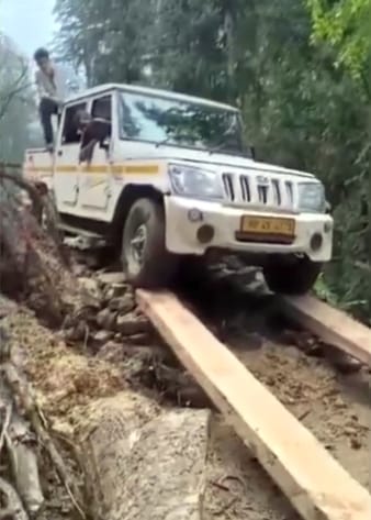 Vehicle pulled out by putting sleepers on damaged road in Ralla