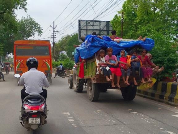 Overloaded autorickshaws running fearlessly