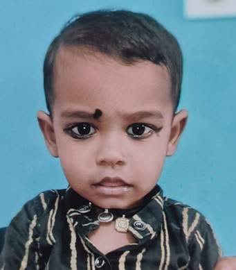 A child died when a car collided with a dumper loaded with soil