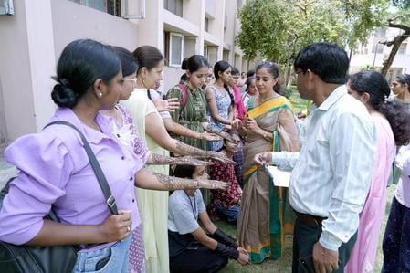Students applied mehndi on the occasion of Saavan festival