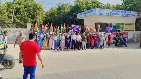 Under the campaign, girl students took out a tricolor march