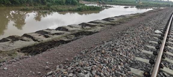 Soil washed away from the side of the track in the rain