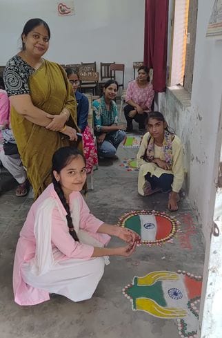 Anamta got first place in rangoli competition