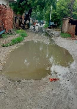 The traffic of the district is getting stuck due to potholes on the roads