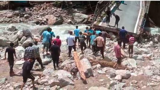 Villagers risked their lives to cross the broken Kalgadi bridge and take the sick to the hospital