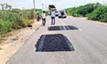 Patchwork was done on the road, but broken dividers still pose a danger