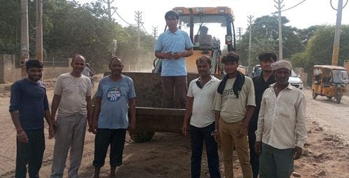 The district councilor demonstrated by climbing on a bulldozer