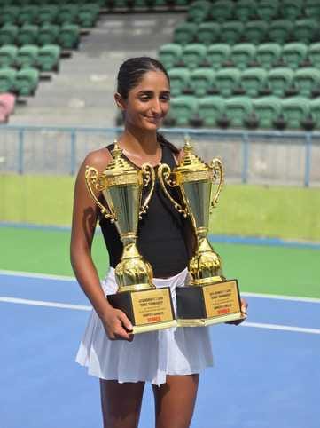 Mahika won the singles and doubles titles in the tennis tournament