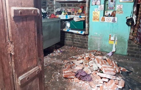 Four people including a girl were injured when a lintel collapsed during the rain