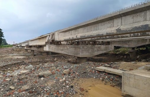 The speed of four-lane construction has slowed down due to rain