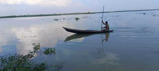 Flood relief material delivered to villagers across the Ganges