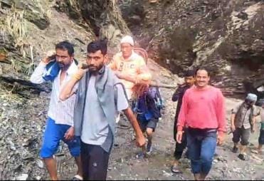 Due to road closure, the sick person was brought to Madkot in a doli