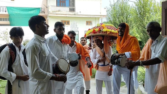 Gugga came out of the temple, going from house to house giving darshan to the people