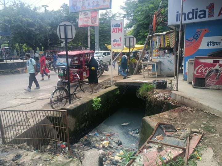 Danger on the road, open drains and broken slabs at some places
