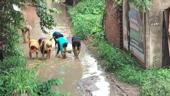 Protest was done by planting paddy on the dilapidated road
