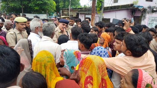 Woman injured in knife attack dies, family members block road