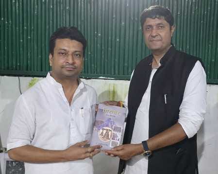 Sudeep Jain presented a book to the MP