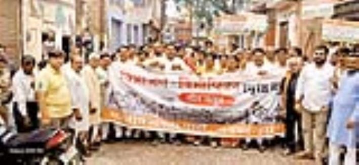 BJP members took out a silent procession and organised an exhibition