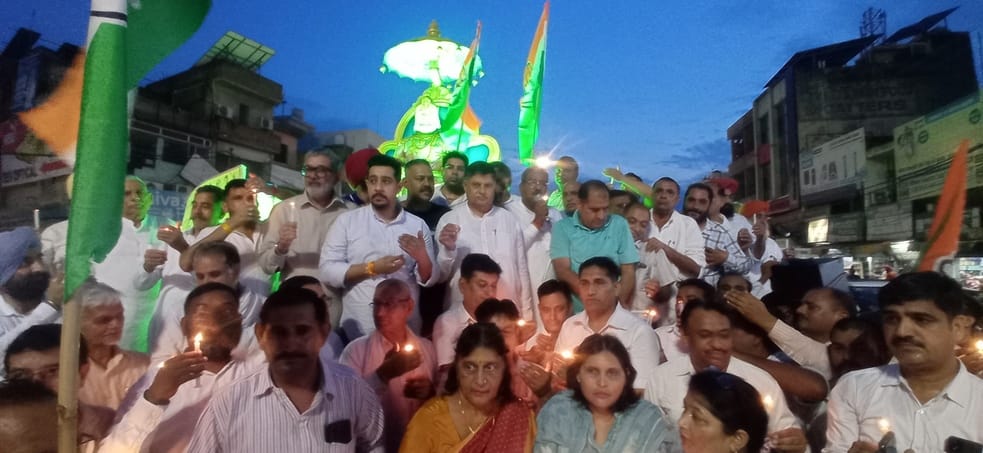 Congress workers took to the streets, expressed their anger by taking out a candle march