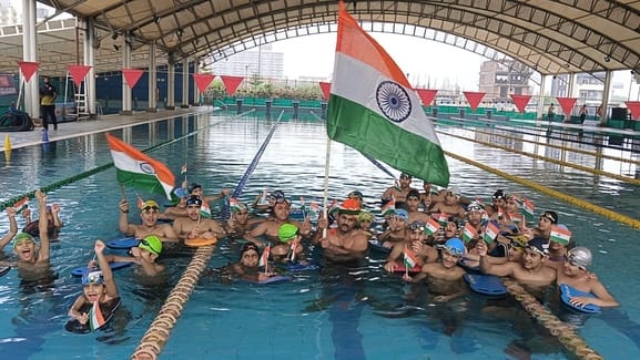 On Independence Day, swimmers did a tricolor parade in the swimming pool