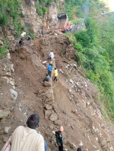 Villagers set an example by repairing damaged roads themselves