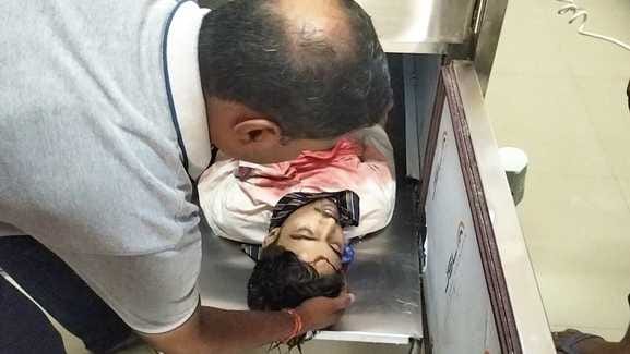 The father kept caressing the dead body of his son in the freezer...