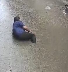 The pothole on the road was not visible due to water filling, a person got injured after falling in it