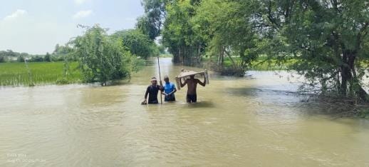 Houses surrounded by flood, water filled on roads