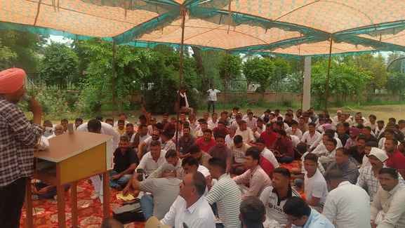 Employees staged a sit-in protest against reduction of posts