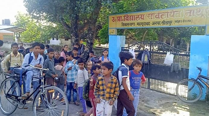 The school did not open till nine o'clock, the children returned