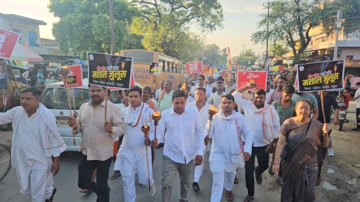 A torchlight procession was taken out in Mant to protest against vote theft.