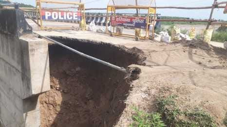 Soil erosion continues from the edge of the bridge