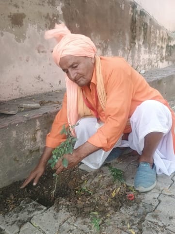 Little wrestler is planting trees to keep the environment clean