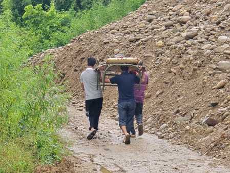 200 meters of road was washed away near Panjwari village, pregnant woman was carried on shoulders and taken to hospital