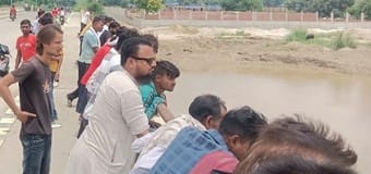 The girl who was talking to a young man suddenly jumped into the Garra river