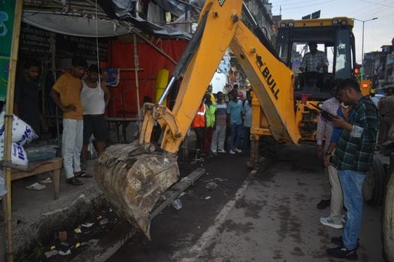 Municipality's bulldozer roars on encroachment of intersections and roads