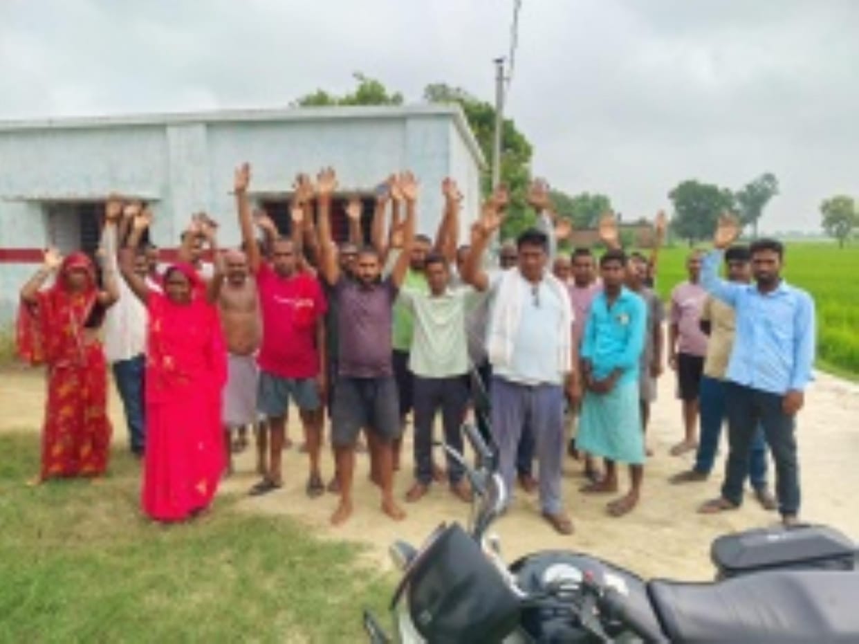 Villagers angry over waterlogging in potholes on the road staged a protest