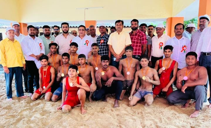Winners of district level wrestling competition were awarded