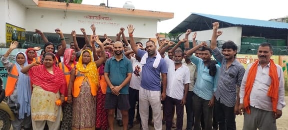Sanitation workers staged a protest demanding timely payment along with salary hike