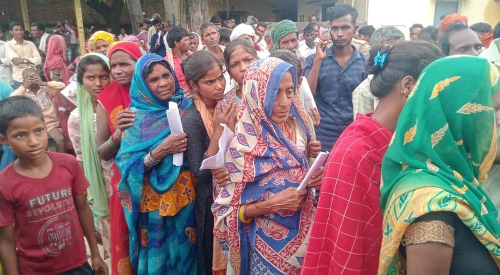 Token in hand, long queue, waited for fertilizer all day
