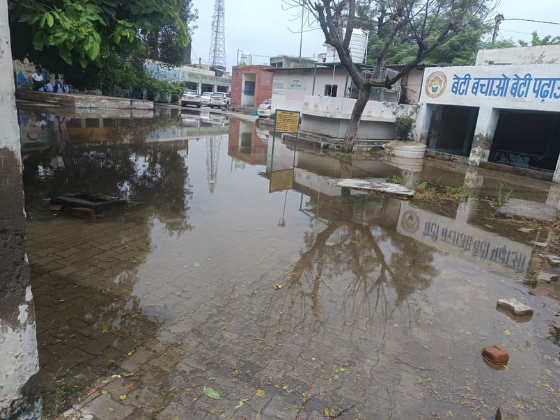 Rain water filled in the school, children studied in the open